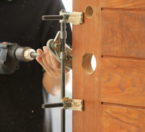 Drilling and installation of new lock on the wooden door